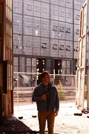 Photographer working with a vintage camera in an urban setting during golden hour.