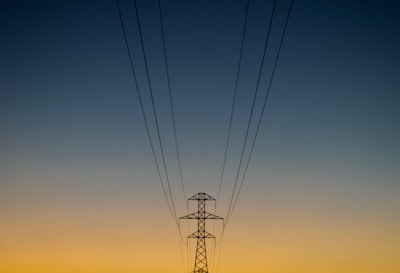 gray utility post during golden hour