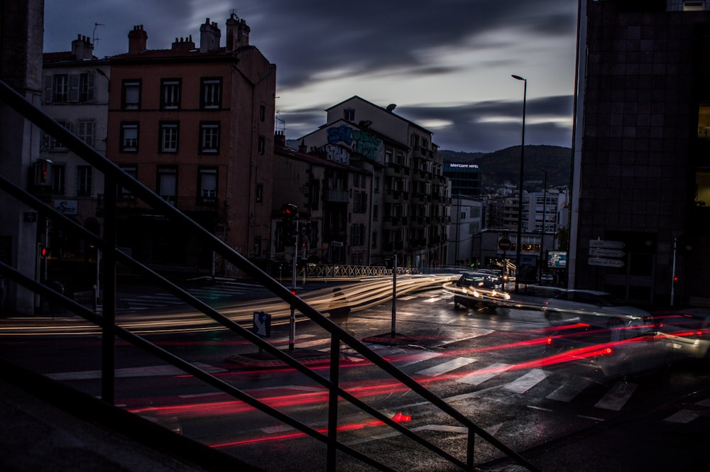 a city street filled with traffic at night