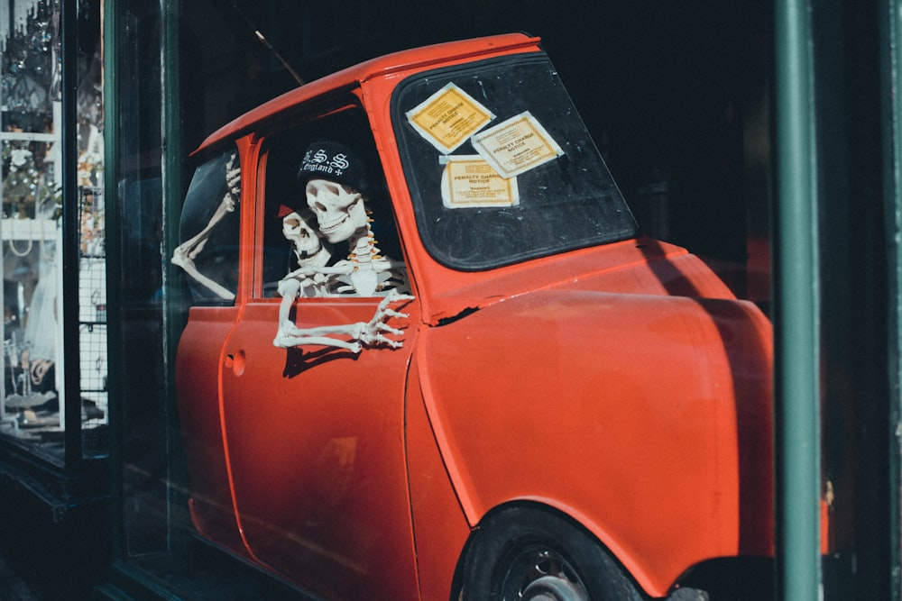 orange vehicle with skeletons