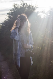 Before and after photo of a person showing weight loss progress in a bright, natural setting