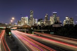 time lapse photography of vehicle traveling with a speed of light in road