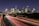 time lapse photography of vehicle traveling with a speed of light in road