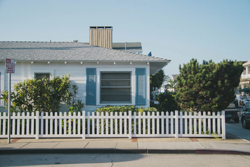 Single story home behind a fence