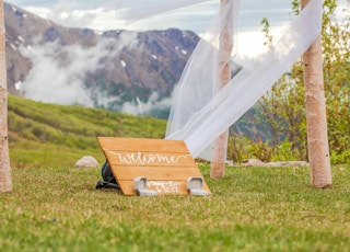 welcome signage on grass field