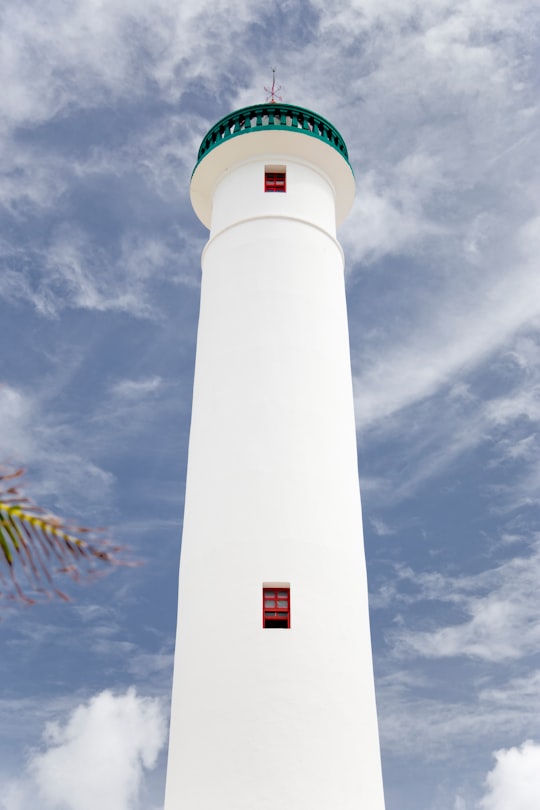 photo of lighthouse under blue sky in Cozumel Mexico