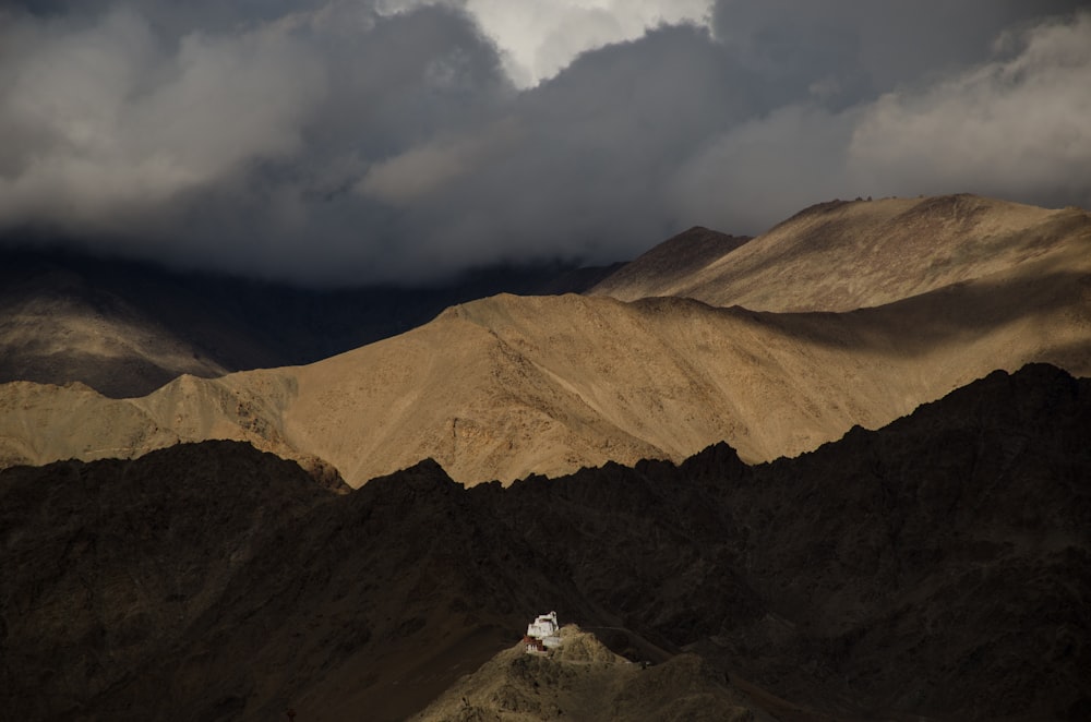 silhouette of mountain under gray sky