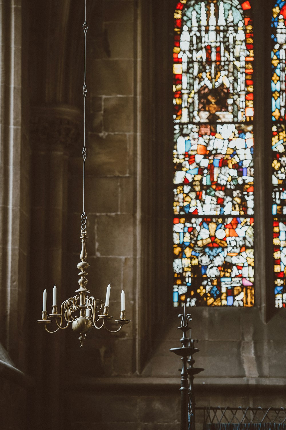 candle chandelier inside a cathedral