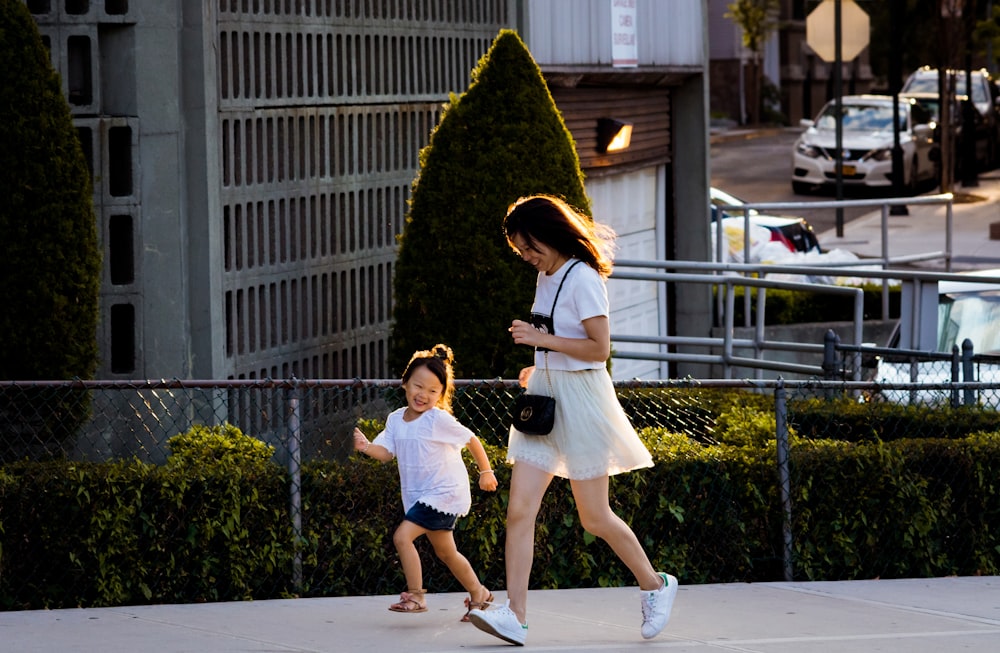 time lapse photography of man and girl running