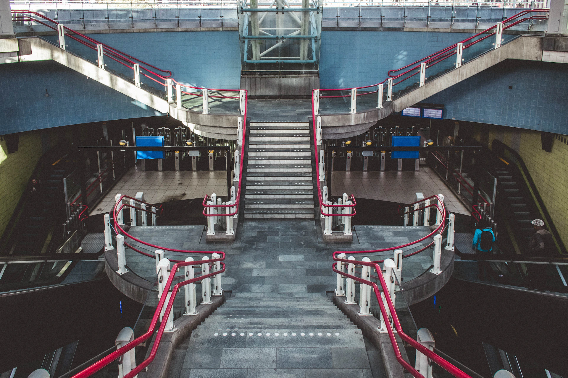 Concept art of a bustling subway station with innovative architecture featuring digital ticket shops and seamless connections to bus stations and parking areas.