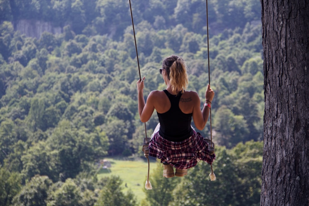 woman riding on swing