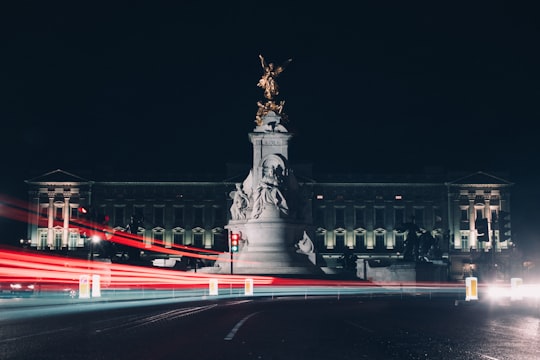 time lapse photography of gray building and statue in Buckingham Palace United Kingdom