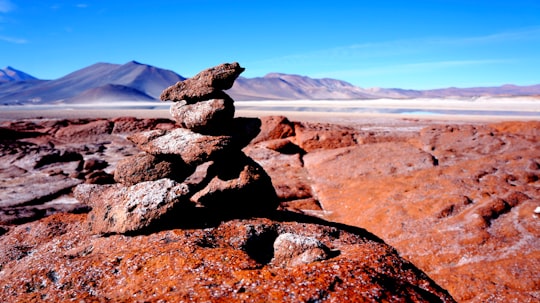 stacked cairn rocks on top of canyon in Atacama Desert Chile