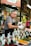man selling assorted seeds