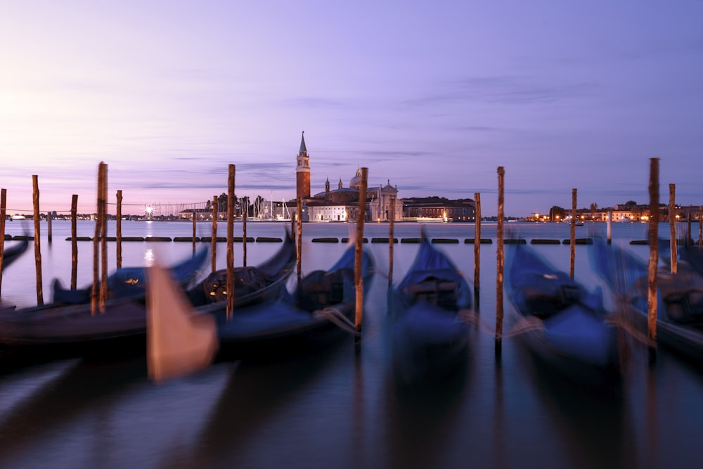 kayak boats on body of water under clear blue sky