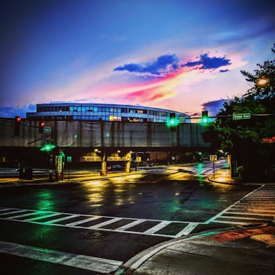 A vibrant city intersection featuring newly installed LED traffic lights glowing at dusk.