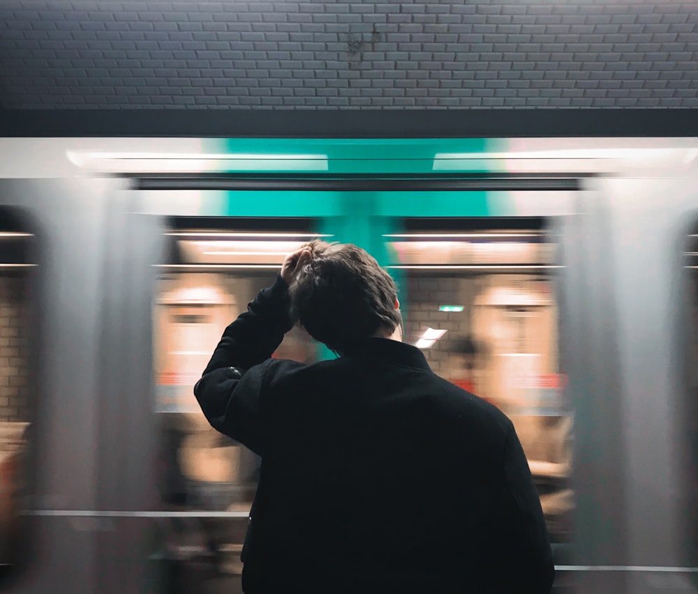 timelapse photography of man in black jacket