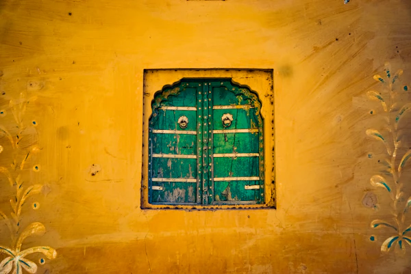 A painted green wooden window