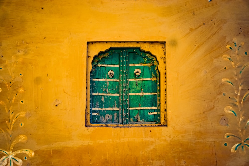 green wooden window painting