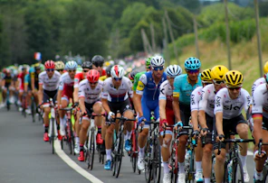 group of men riding bicycle