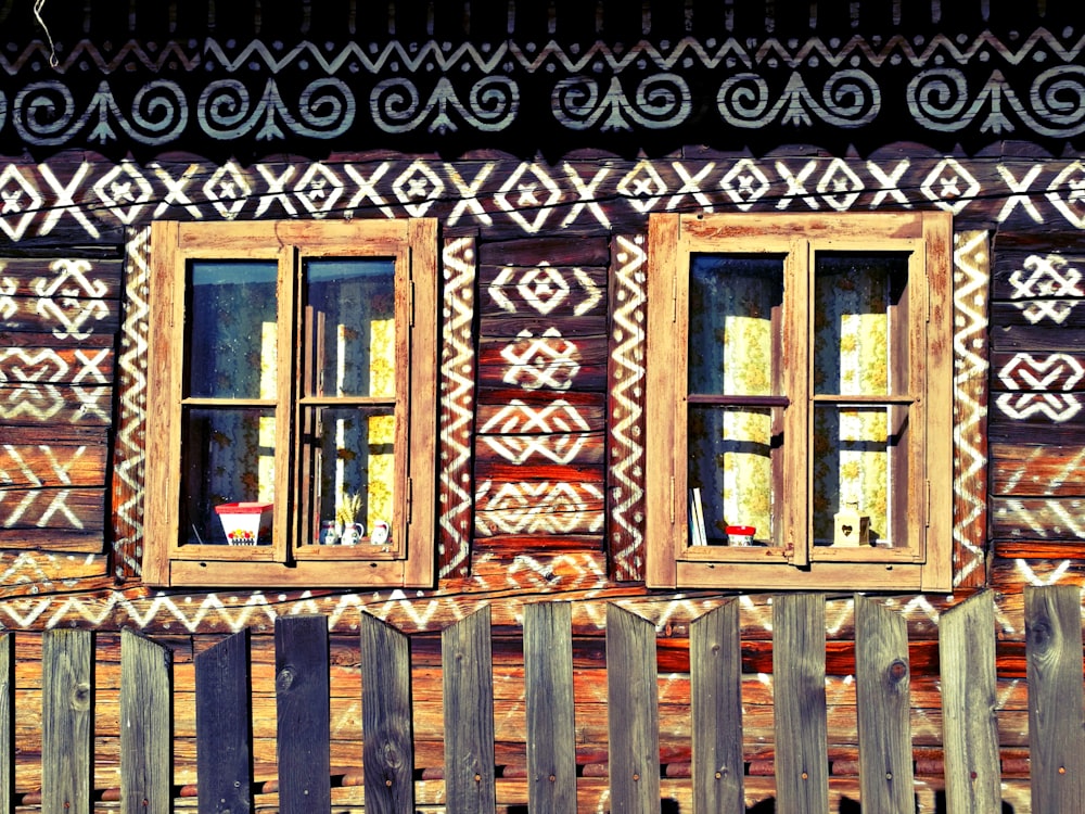 two brown wooden window closed