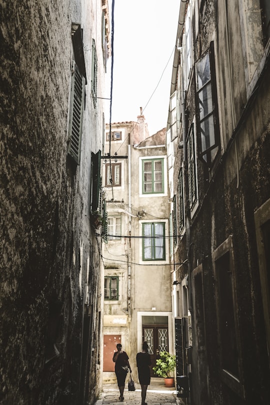 two person walking on the street during daytime in Šibenik Croatia