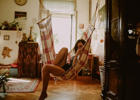 woman sitting on hammock