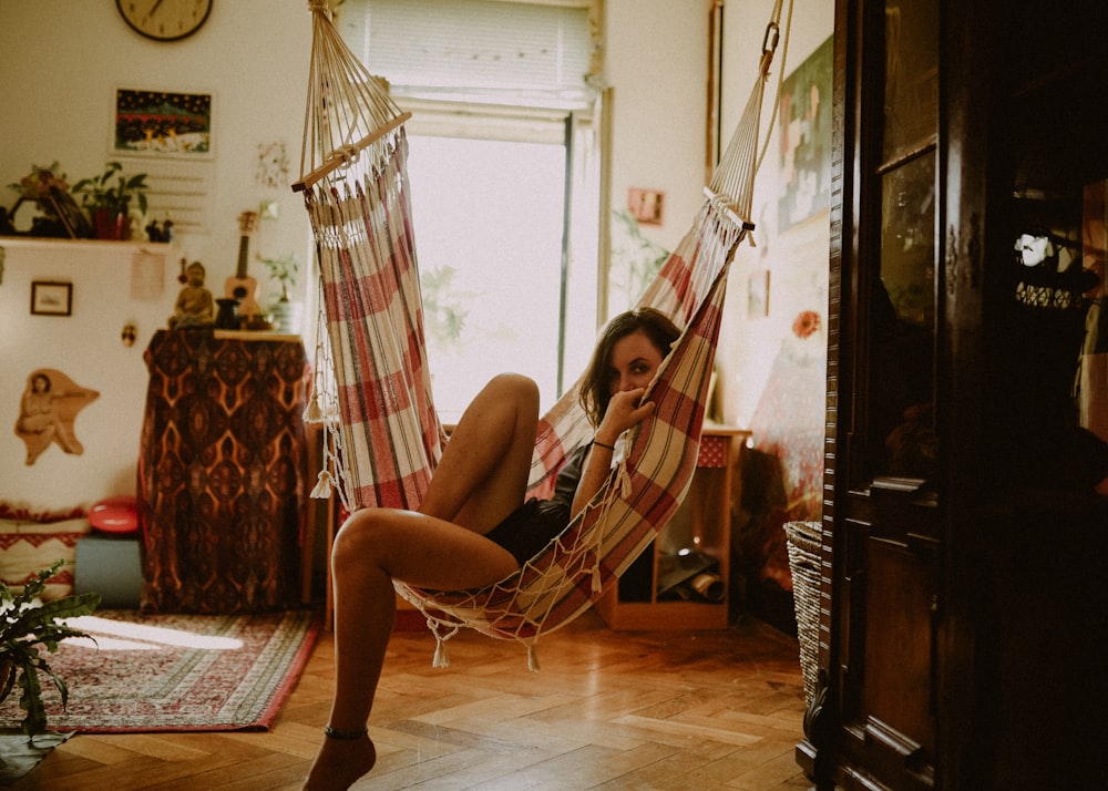 woman sitting on hammock