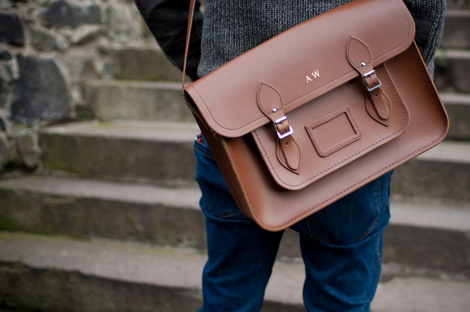 Nikon D90 + Sigma 30mm F1.4 EX DC HSM sample photo. Person carrying brown leather photography