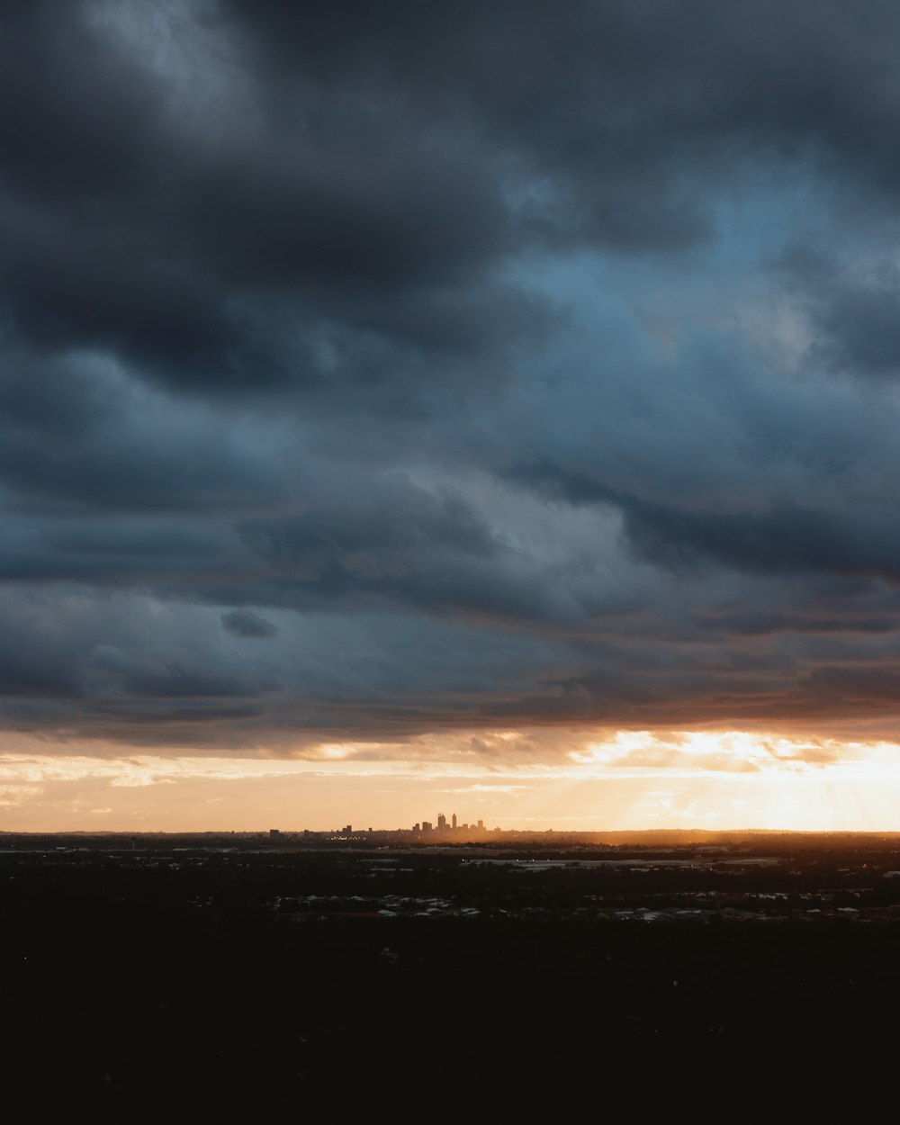 cloudy sky above cityscape