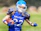 woman in blue helmet playing football