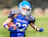 woman in blue helmet playing football