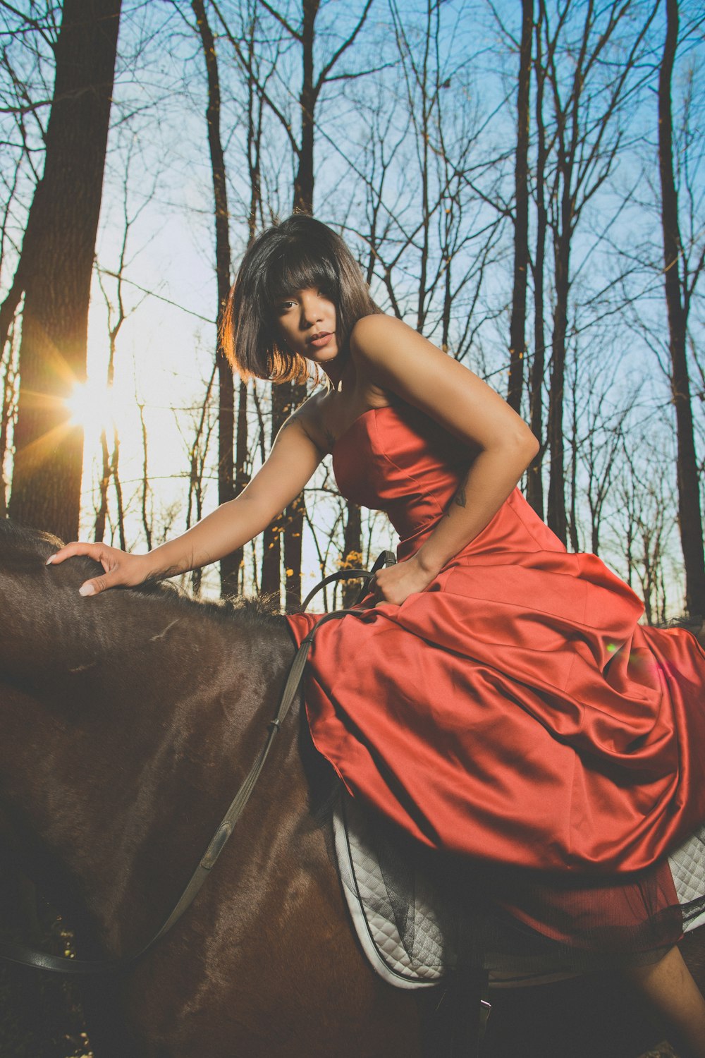 woman rides on horse