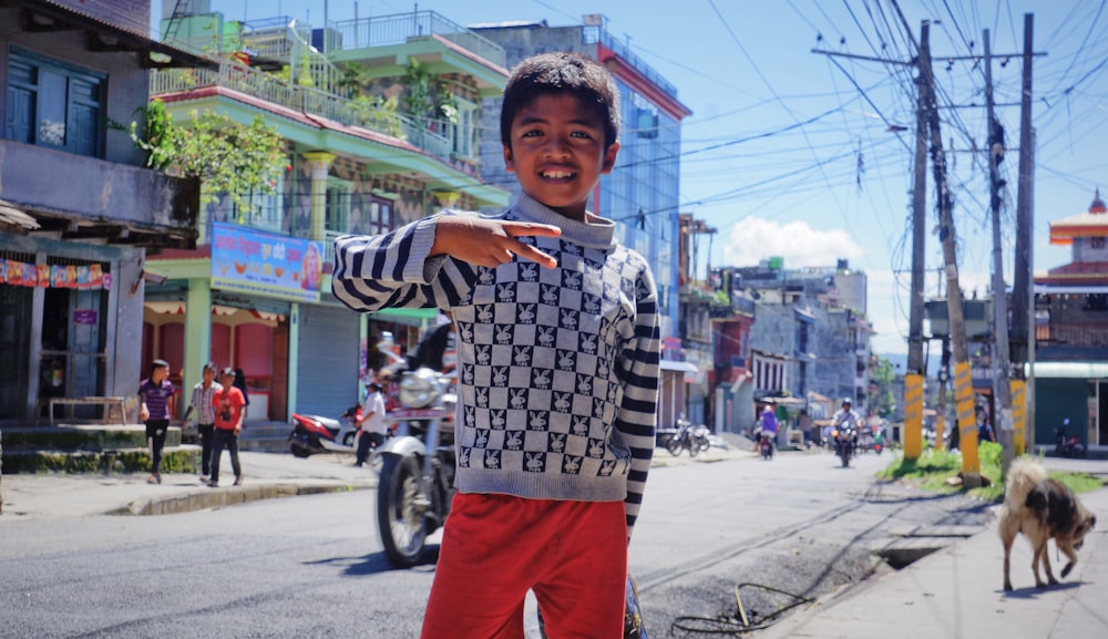 boy standing on roadside