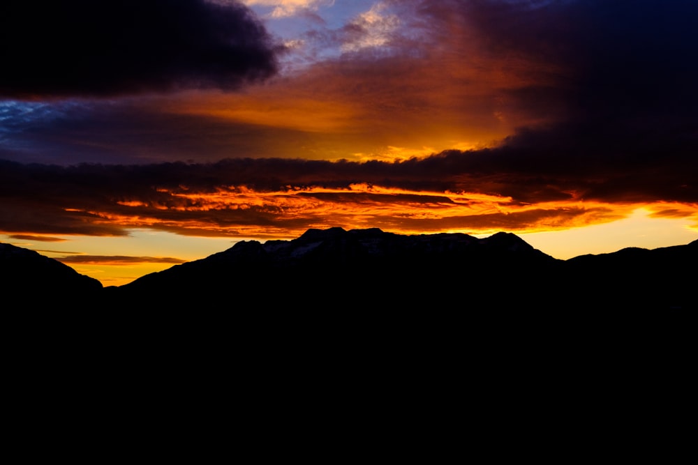 silhouette of mountains during golden hour