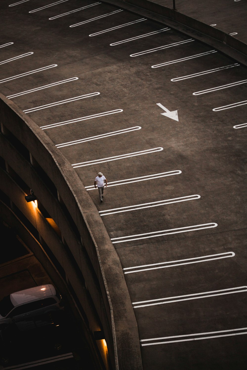 man walking on brown concrete paving