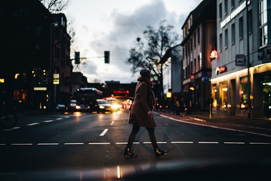 woman crossing on road in Wolbecker Straße Germany