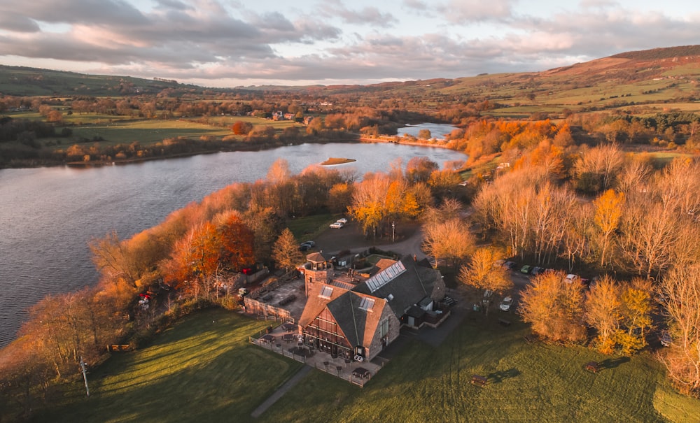 aerial view of house beside water