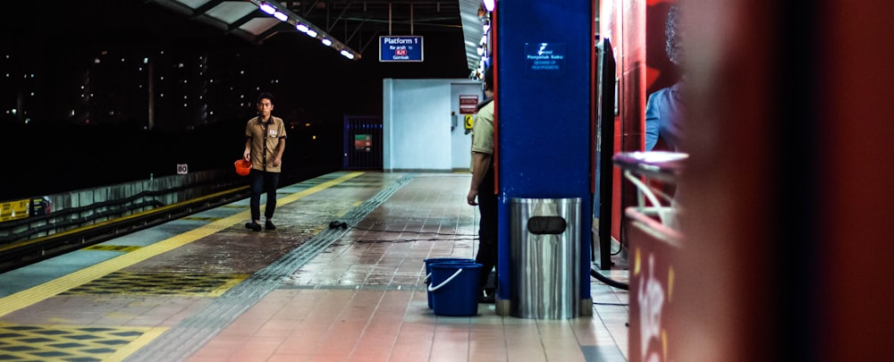 man walking in train station