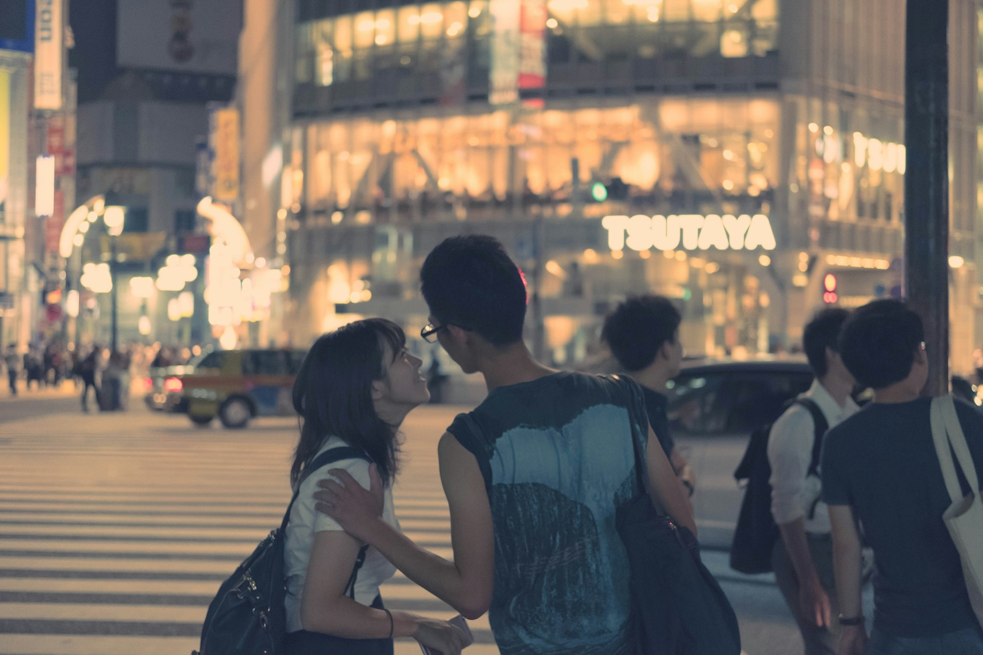 A vibrant still from a short film by Michael & Jessica Magsombol, capturing a heartfelt moment in a bustling New York street.