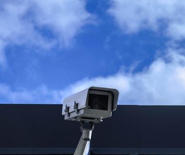 white security camera at daytime