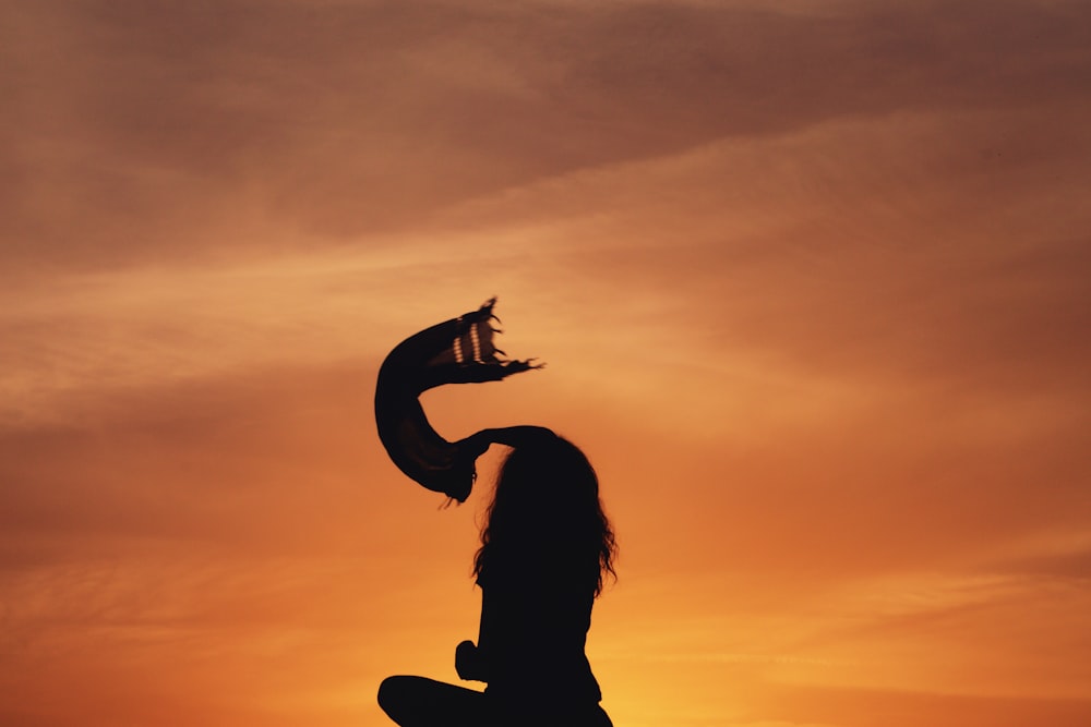 silhouette woman sitting