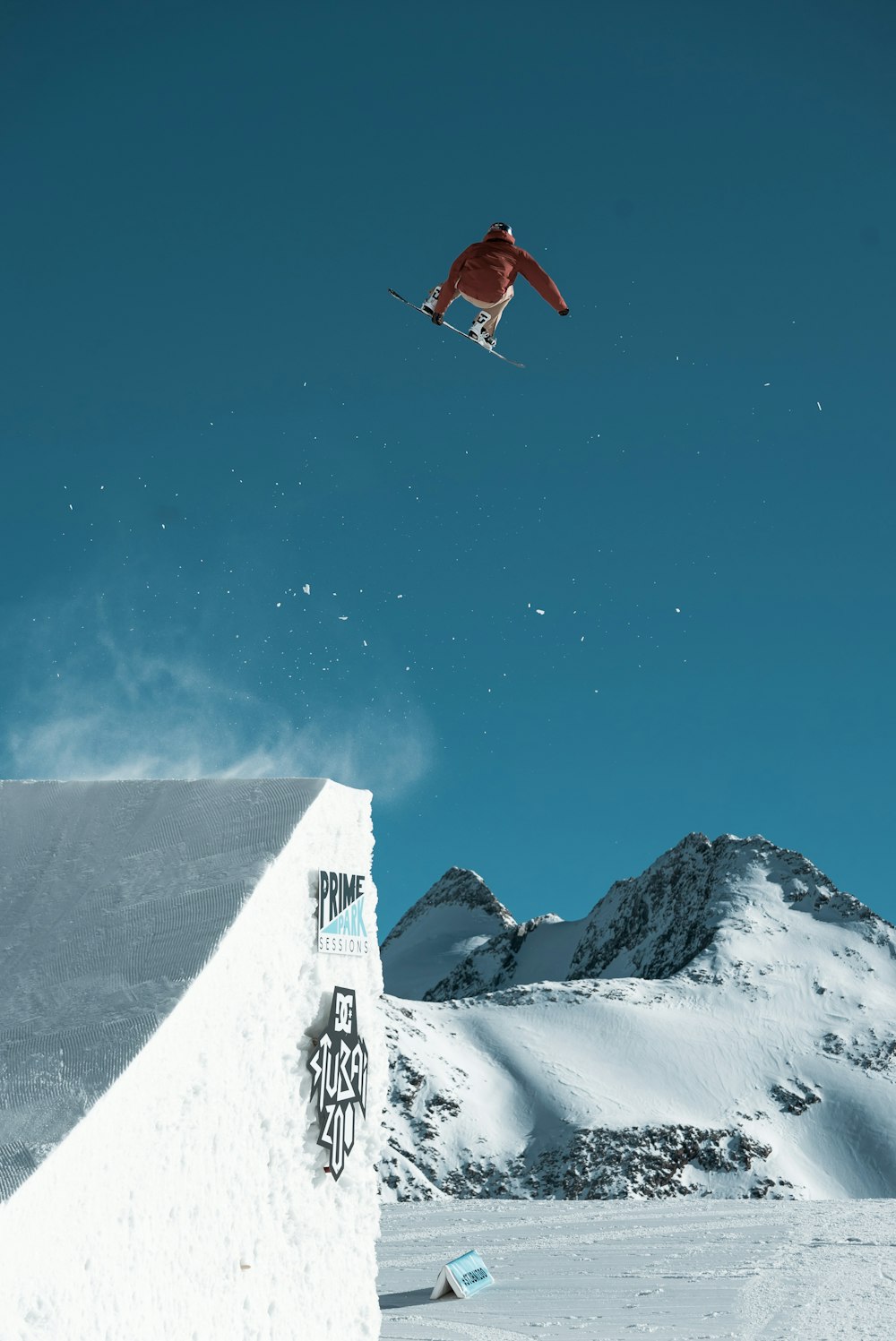 man riding snowboard