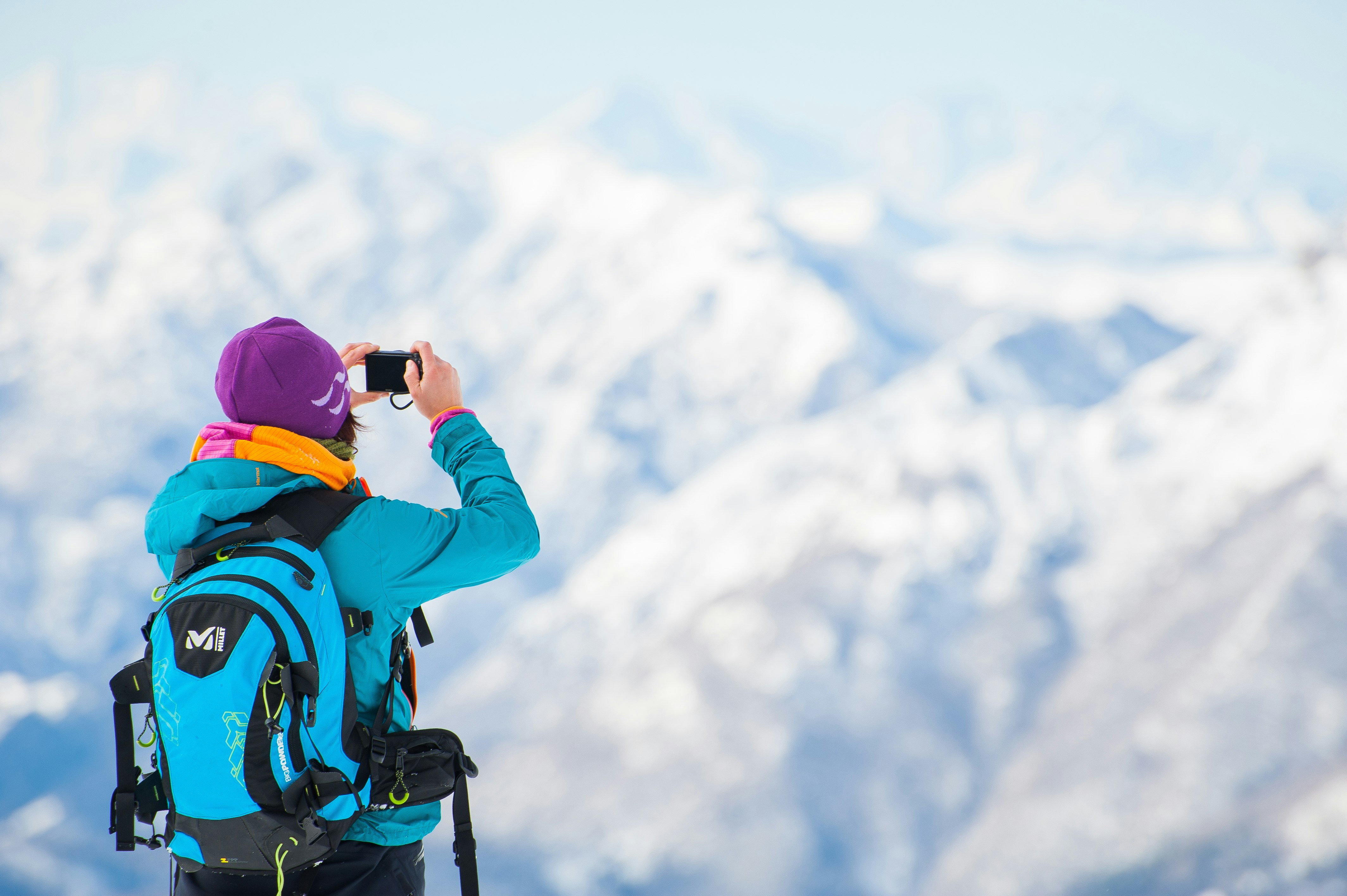 selective focus photography of man holding camera