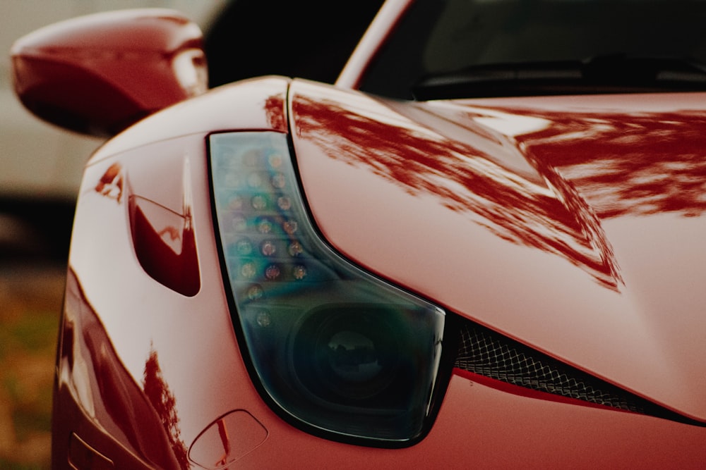 macro photography of red sports car