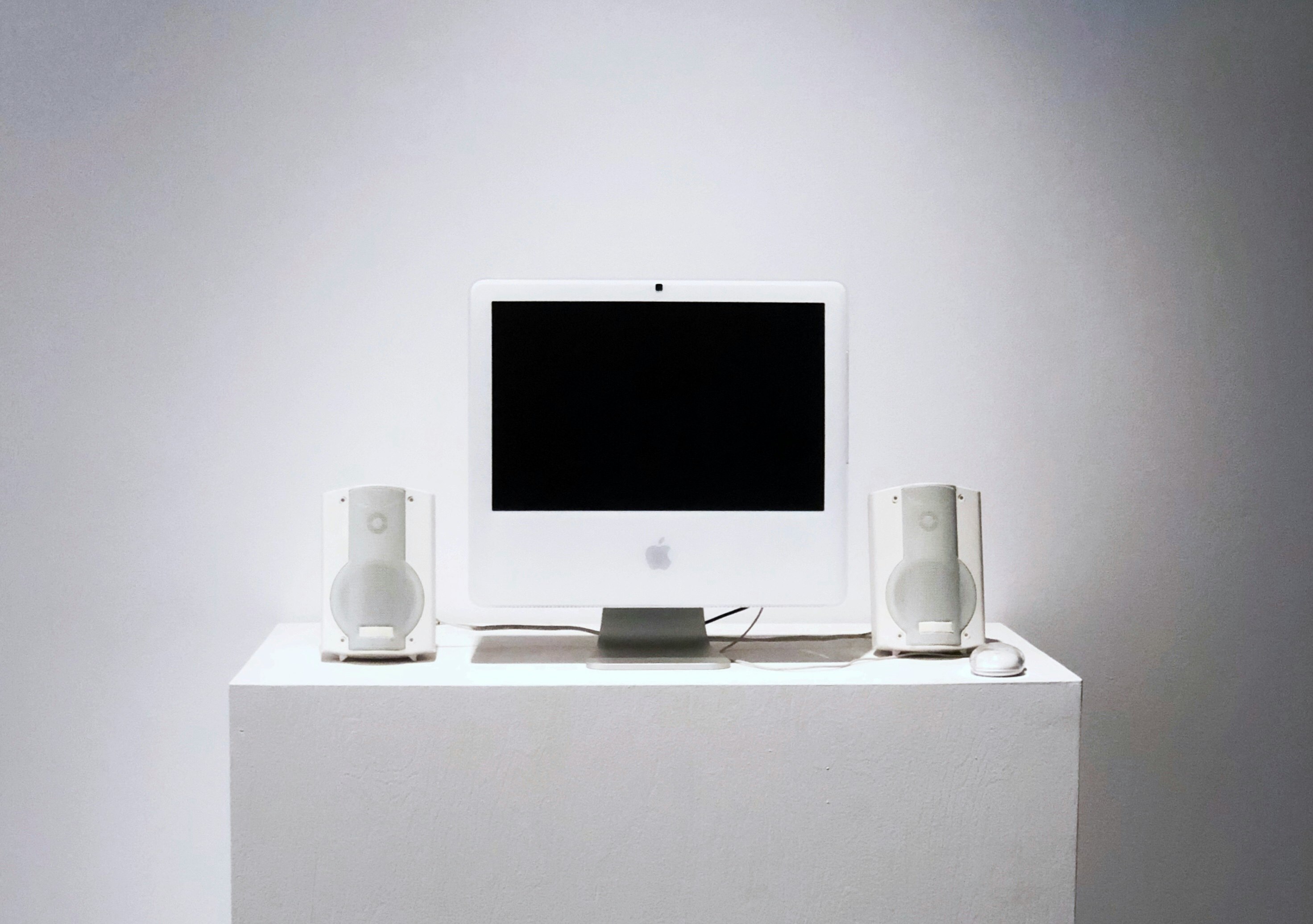 Apple Studio Display monitor on white table
