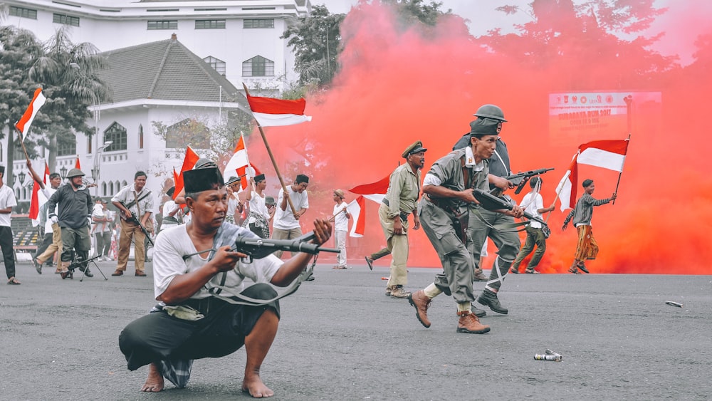 man holding gun during daytime