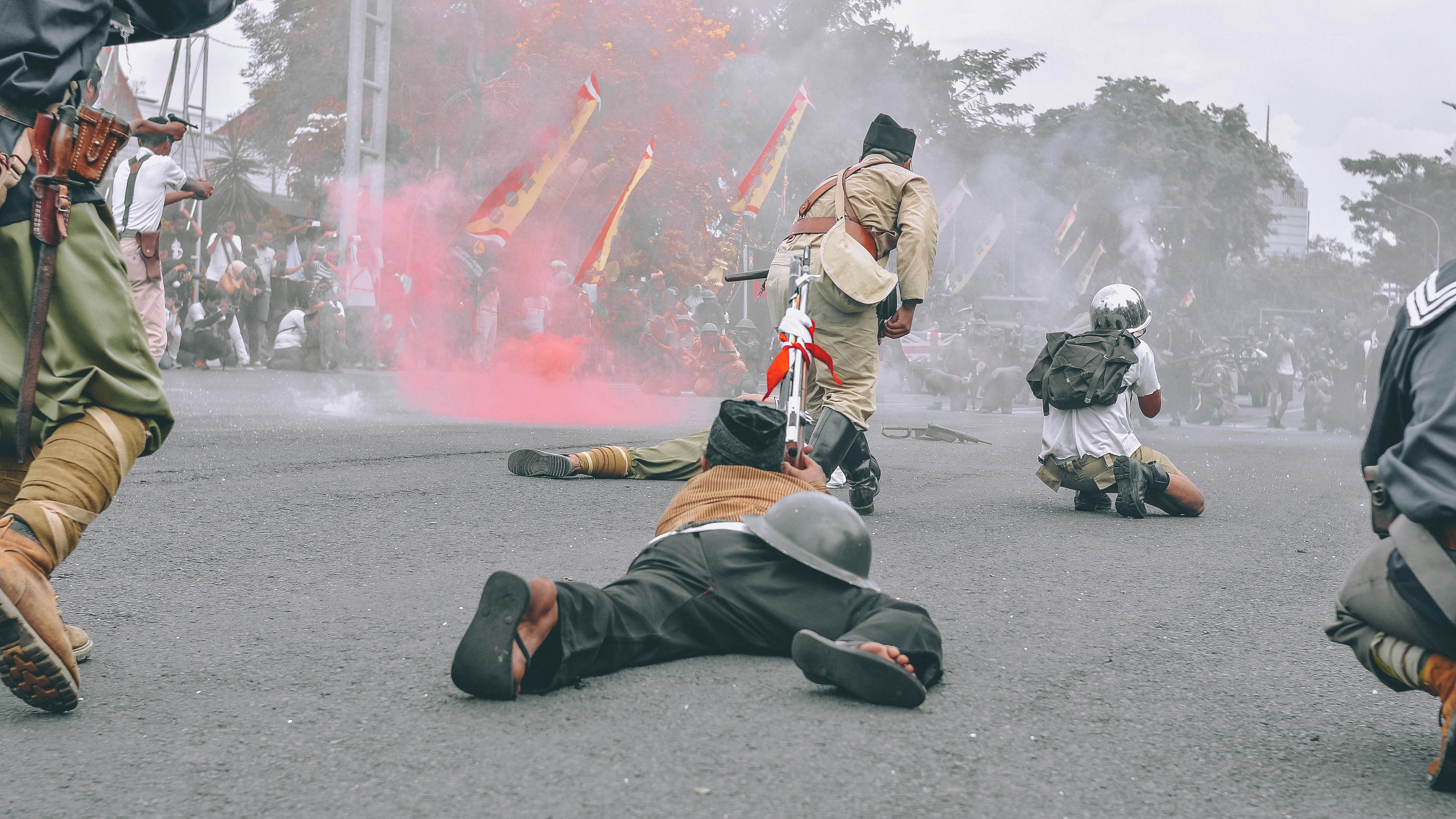group of men in the middle of road