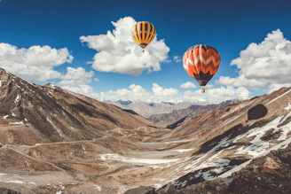 two hot air balloons floating