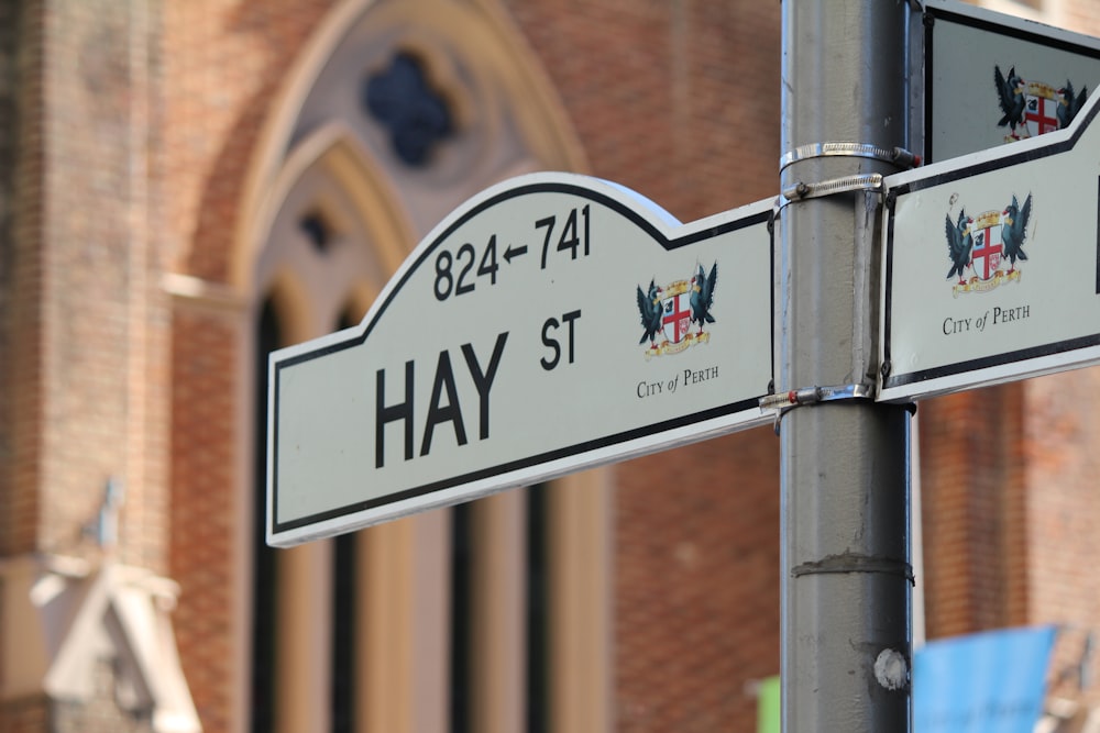 gray Hay St. signage at daytime